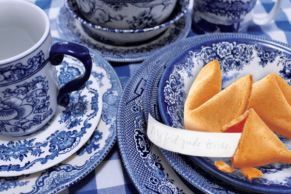 Fortune Cookies on a plate with tea.